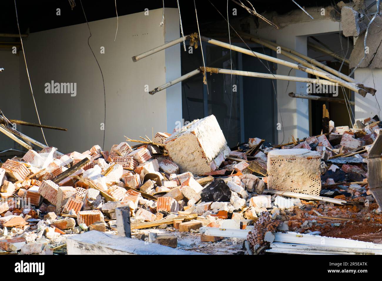Background of process of demolition of building. Excavator breaking old ...