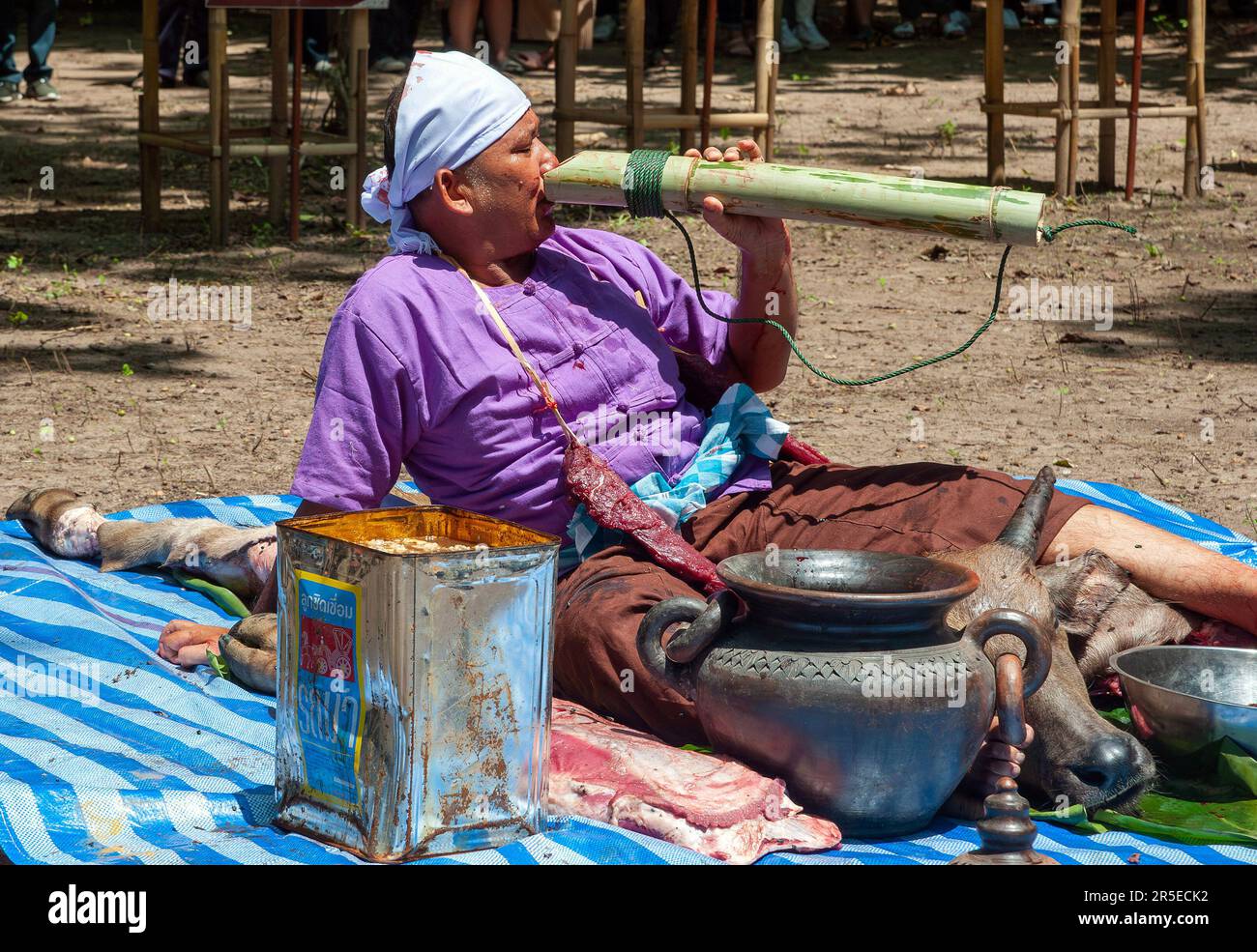 A Thai man involves ' medium ' drinks water during the Pu Sae Ya Sae ...