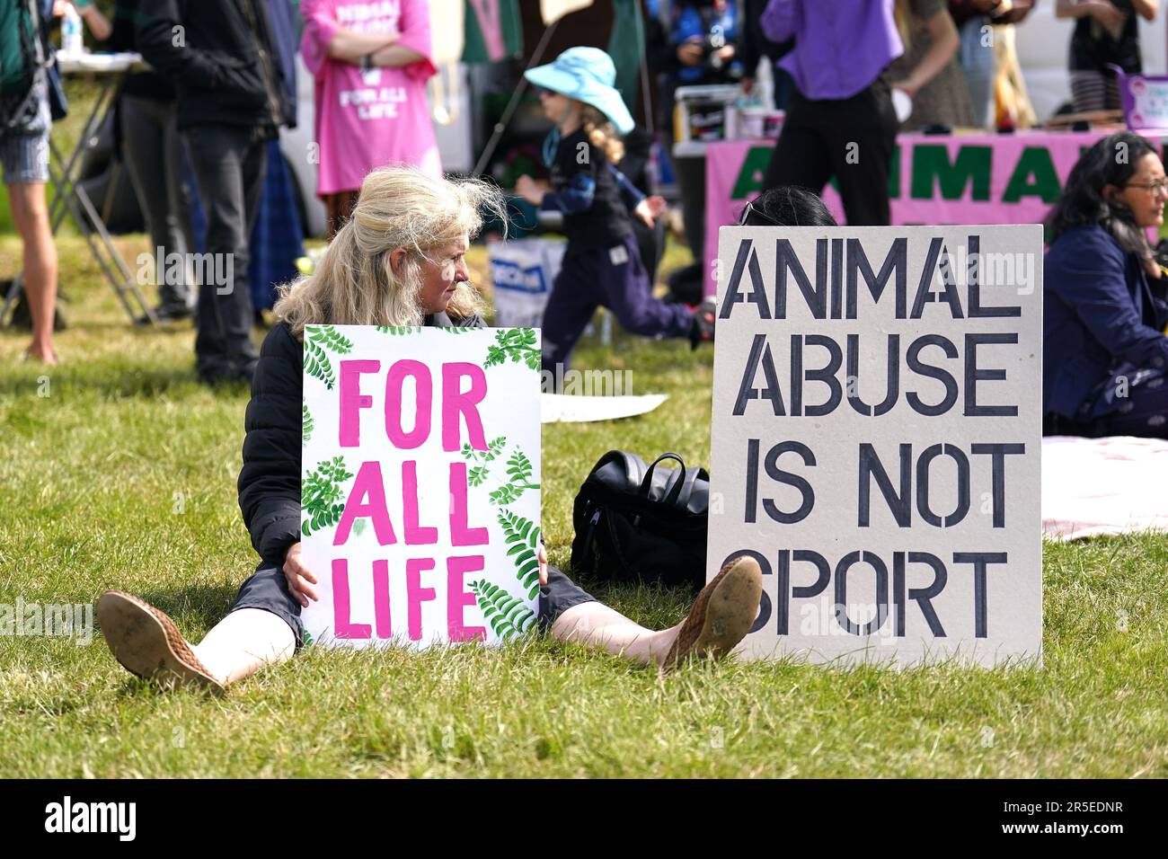 Animal rights protest group Animal Rising with signs outside the entrance of the race course