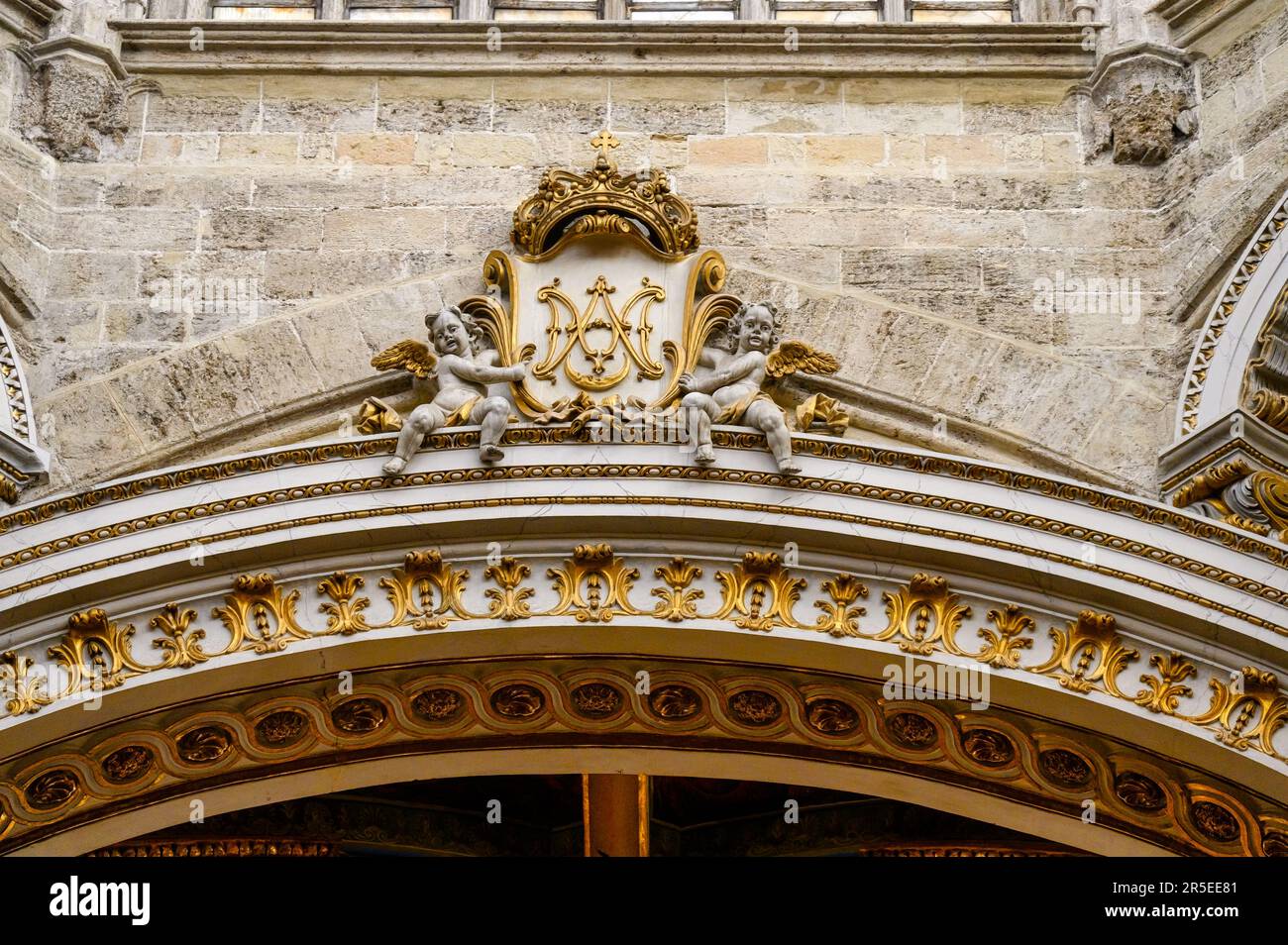 Valencia, Spain - July 17, 2022: Decoration on top of a door. Interior architectural features in the Metropolitan Cathedral–Basilica of the Assumption Stock Photo