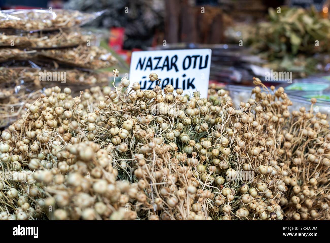 Dried Peganum harmala (uzerlik). Close-up of Peganum harmala in a local street market. Stock Photo
