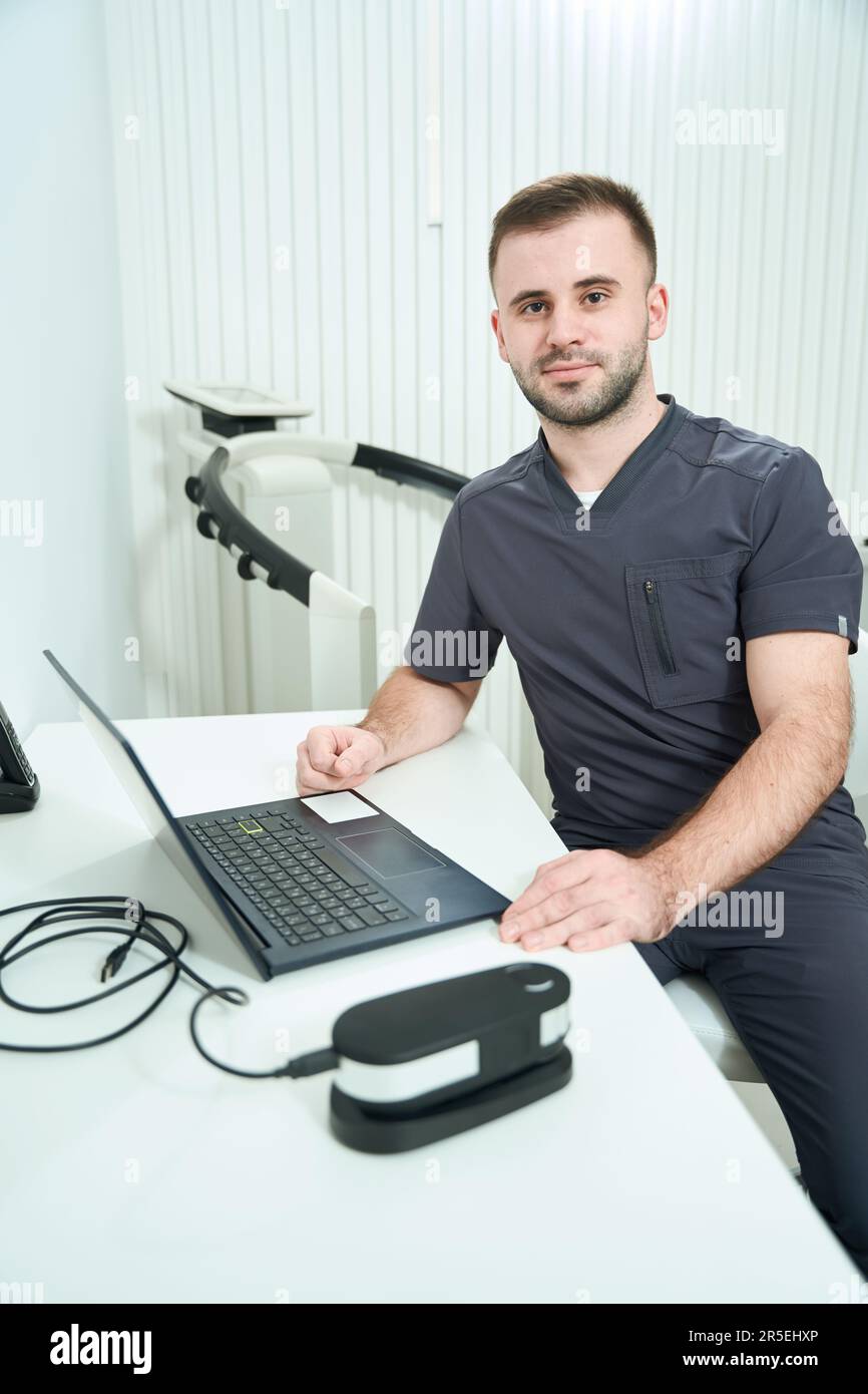 Specialist nutritionist sits at his workplace at his desk Stock Photo