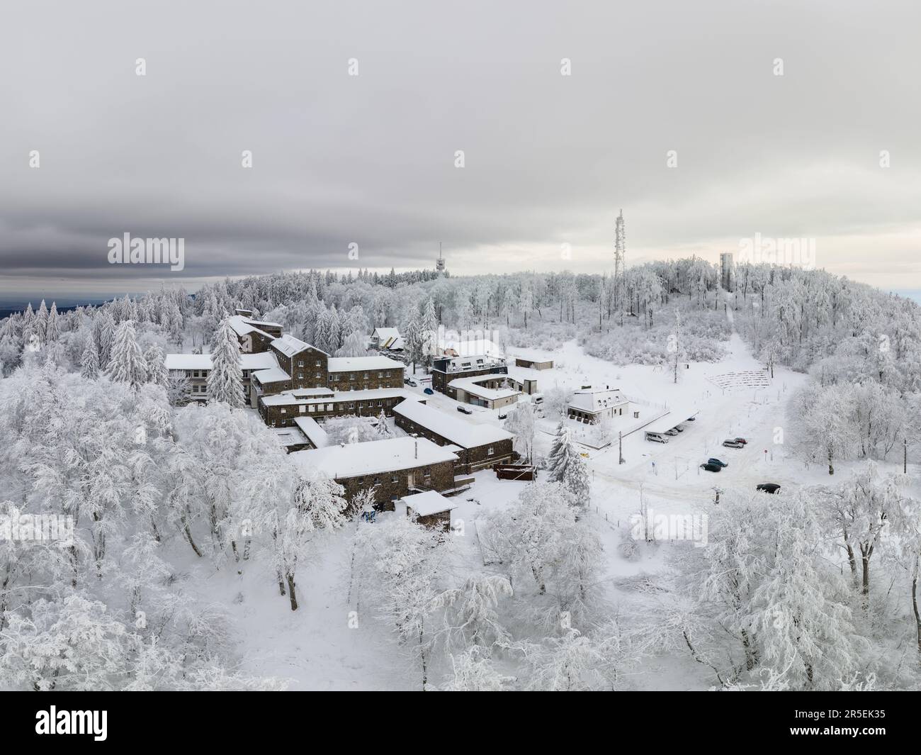 Winter landscape in Galyteto Hungary. Snow fresh snow covered all of muntain top. There is the famous lookout tower and tourist hotel, skilines. Famou Stock Photo
