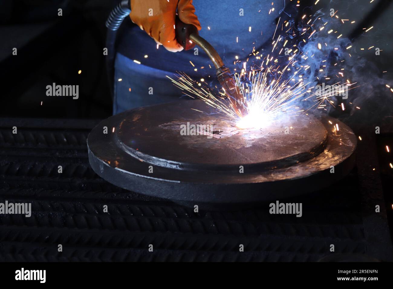 Welding works. Sparks, molten metal Stock Photo