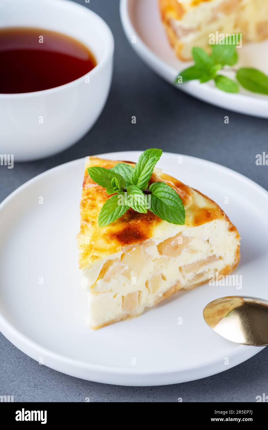 Cottage cheese casserole with an apple and a cup of tea Stock Photo