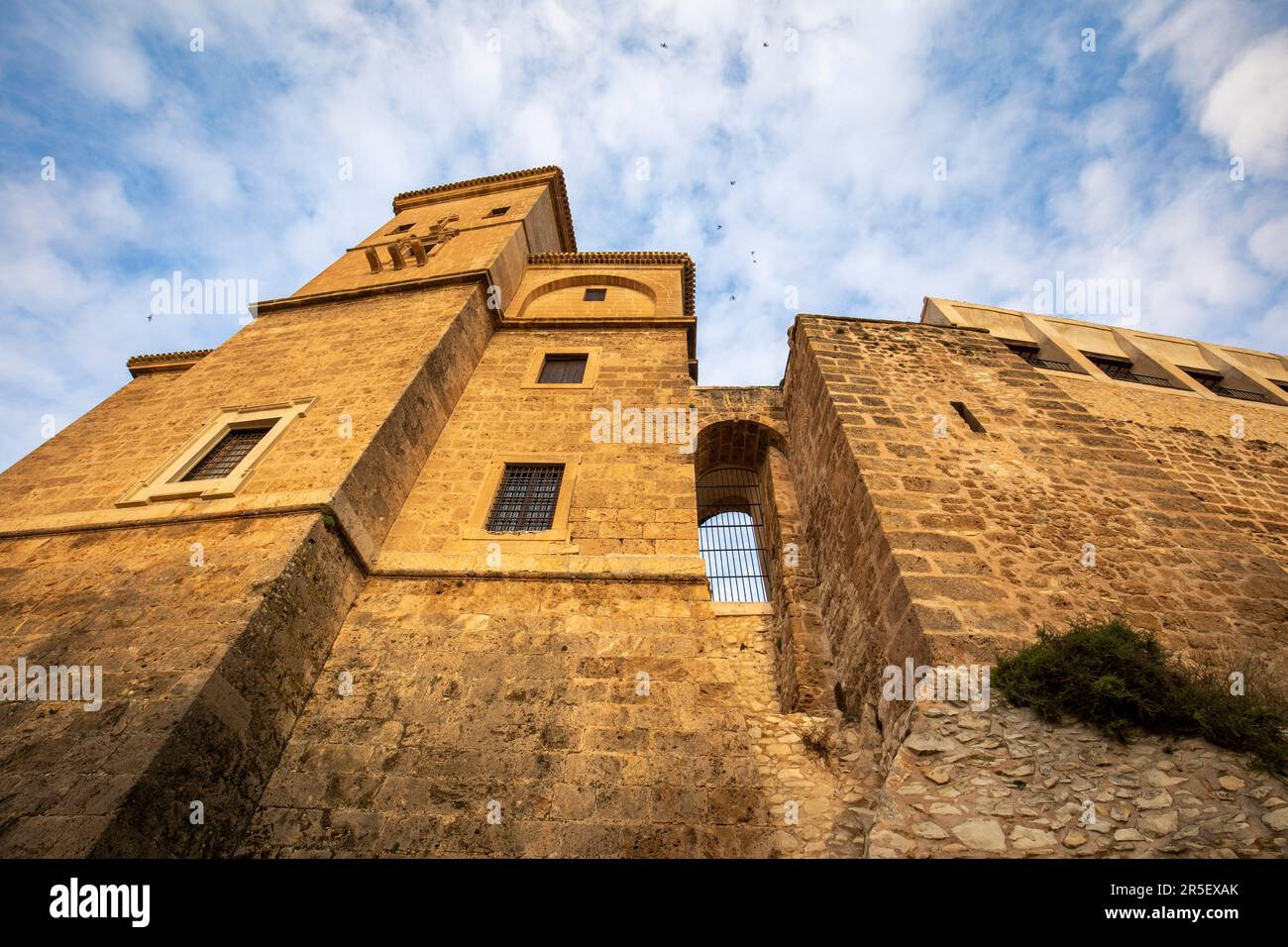 View from below of the impressive medieval walls of the castle of Caravaca, Murcia, Spain. Stock Photo