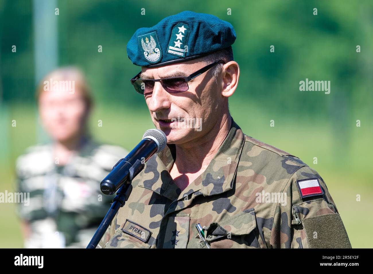 03 June 2023, Poland, Gubin: Colonel Grzegorz Dyrka, commander of the Zielona Gora branch of the Polish Army's Central Military Recruitment Center, delivers a speech at the opening of the 26th Oderland March. For the 26th German-Polish Oderland March, 87 teams as well as 39 individual starters, a total of about 500 participants from the German Armed Forces, police and fire department as well as the armed forces from Poland, the Czech Republic, France, Latvia and the USA have registered. The participants will run 10 km, cross the border river Neisse, shoot with sporting rifles and transport inj Stock Photo