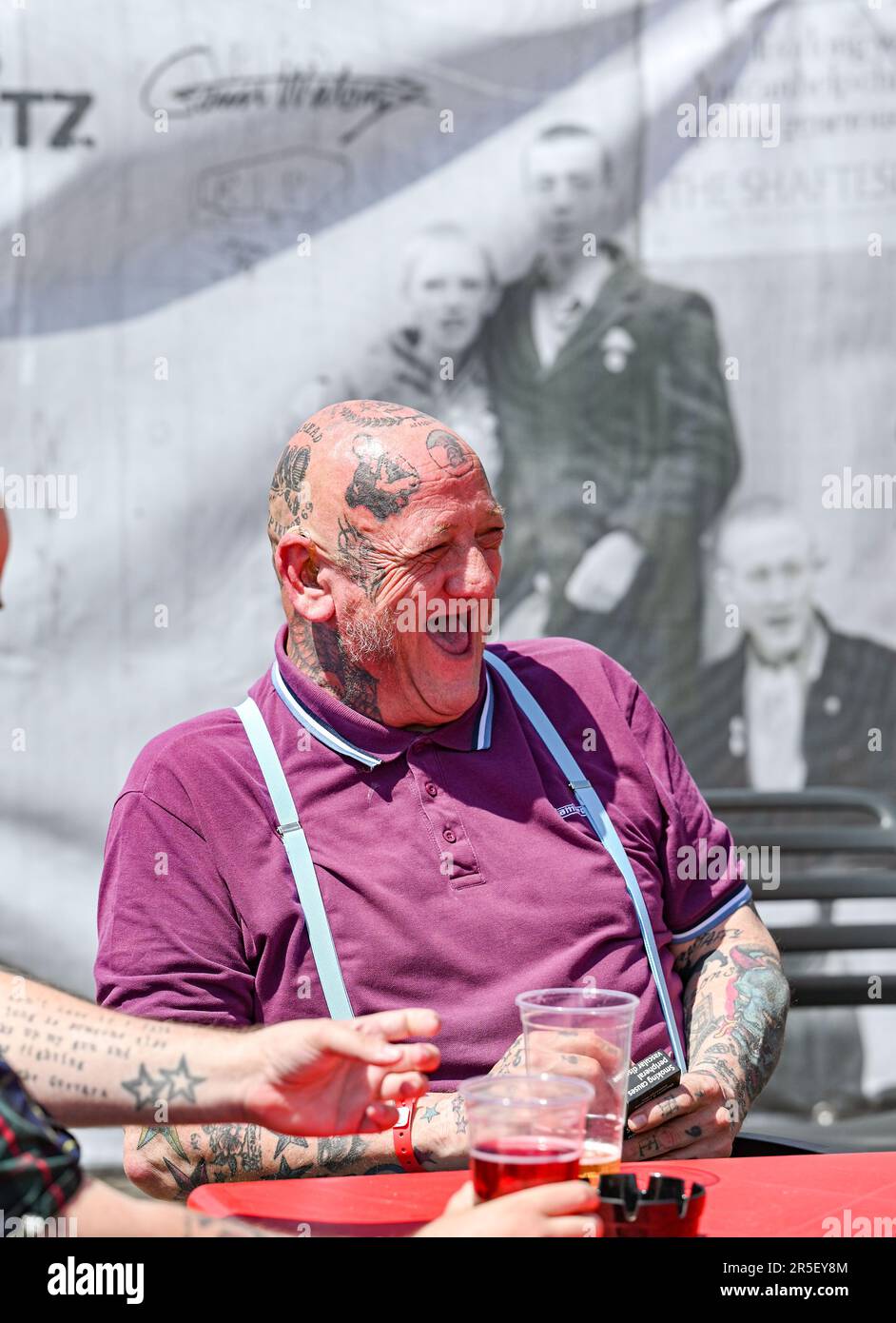 Brighton UK 3rd June 2023 - Skinheads enjoy the sunshine at the annual Great Skinhead Reunion weekend in Brighton where they gather from around the World to enjoy their music and fashion: Credit Simon Dack / Alamy Live News Stock Photo