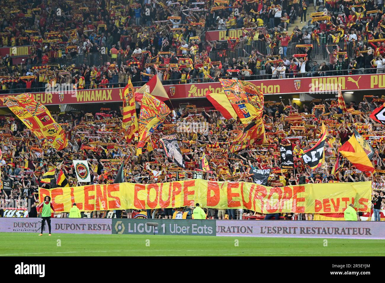 fans and supporters of RC Lens pictured with a banner with RC Lens Coupe  d'Europe Devils on it during a soccer game between t Racing Club de Lens  and AC Ajaccio, on