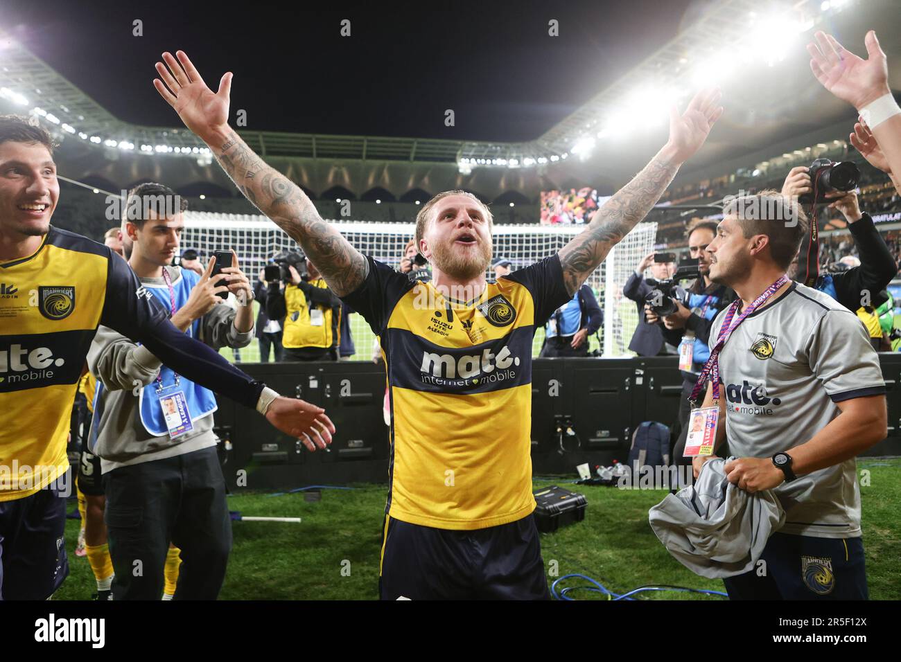 Sydney, Australia. 03rd June, 2023. Jason Cummings of Central Coast Mariners celebrates with fans and team mates after winning the Grand Final during the Isuzu UTE A-League 2023 Grand Final match between Melbourne City and Central Coast Mariners at the CommBank Stadium, Sydney, Australia on 3 June 2023. Photo by Peter Dovgan. Editorial use only, license required for commercial use. No use in betting, games or a single club/league/player publications. Credit: UK Sports Pics Ltd/Alamy Live News Stock Photo