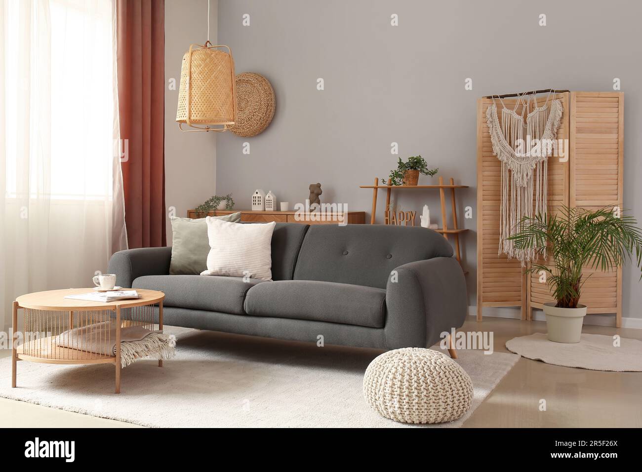 Interior of living room with grey sofa and wooden coffee table Stock ...