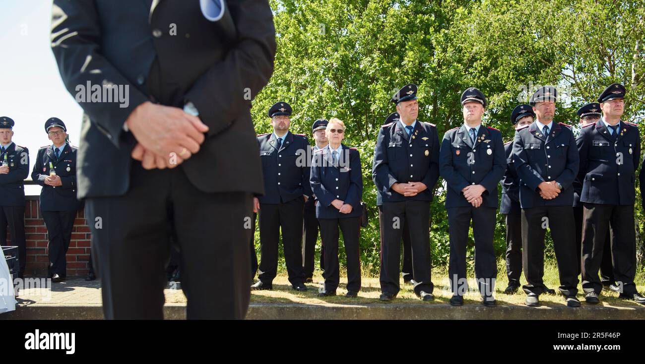 Eschede, Germany. 03rd June, 2023. Members of local fire departments stand in front of the memorial to the victims of the Eschede ICE accident on the 25th anniversary. On June 03, 1998, after a wheel tire broke in Eschede, Lower Saxony, several carriages of an ICE train crashed into a road bridge at a speed of 200. 101 people died. Credit: Gregor Fischer/dpa/Alamy Live News Stock Photo