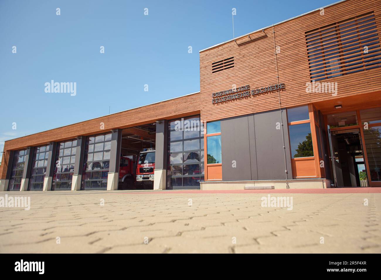Eschede, Germany. 03rd June, 2023. Exterior view of the main building of the local volunteer fire department on the 25th anniversary of the Eschede ICE accident. On June 03, 1998, after a wheel tire broke in Eschede in Lower Saxony, several rail cars of an ICE train collided with a road bridge at a speed of 200. 101 people die. Credit: Gregor Fischer/dpa/Alamy Live News Stock Photo