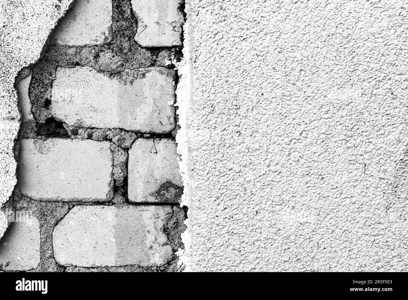 Brick wall. Caving plaster with exposed bricks Stock Photo Alamy