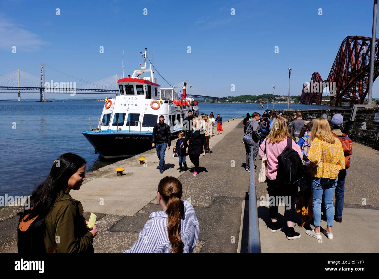 South Queensferry, Scotland, UK. 3rd Jun 2023.  A hive of activity at South Queensferry with visitors enjoying the fine sunny weather and participating in various watersport activities and boat trips. Maid of the Forth boat tours with passengers at Hawes Pier waiting to embark for a trip around the estuary and bridges. Credit: Craig Brown/Alamy Live News Stock Photo