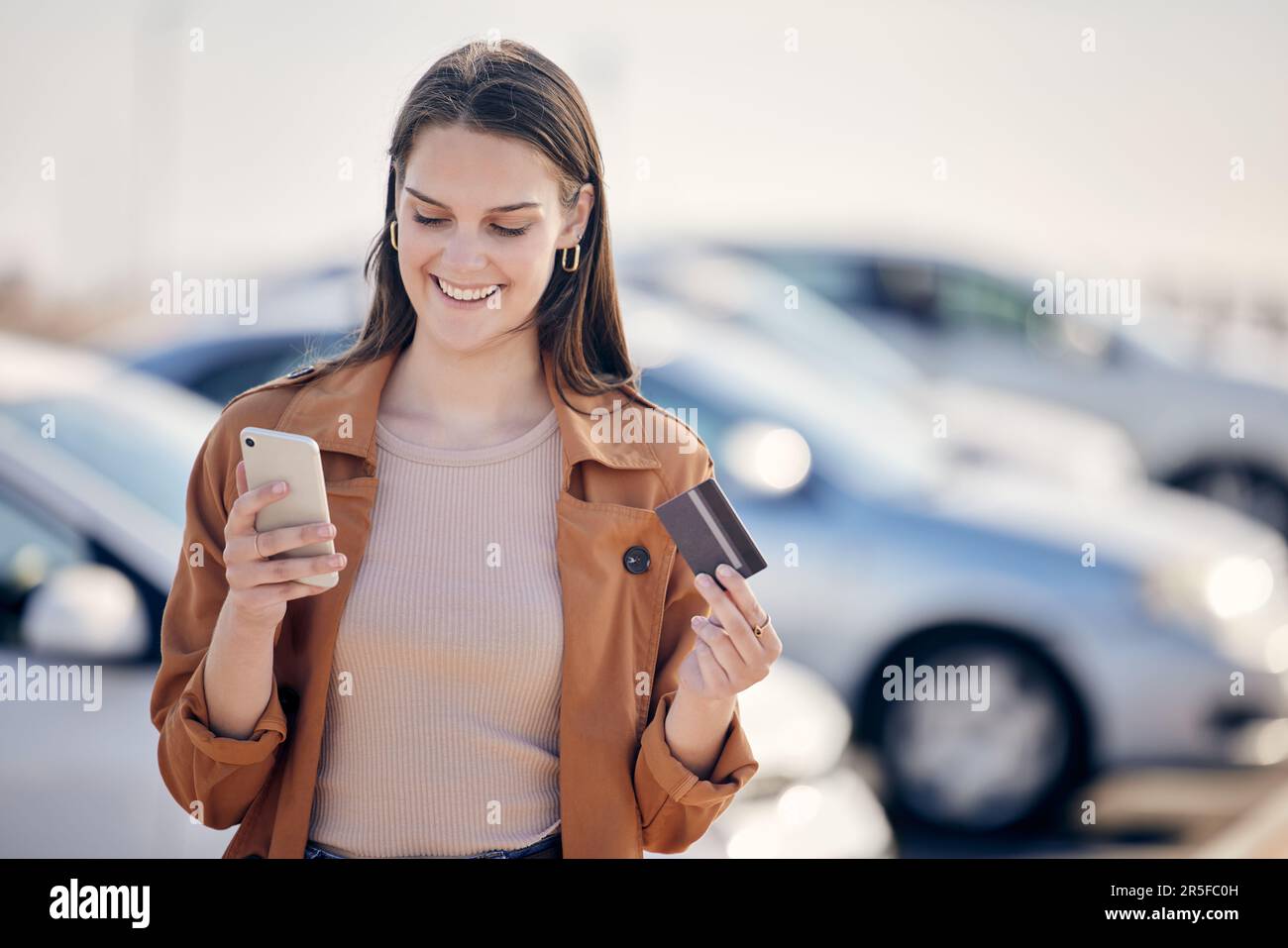 Credit card, phone and a woman with a car payment, online shopping or