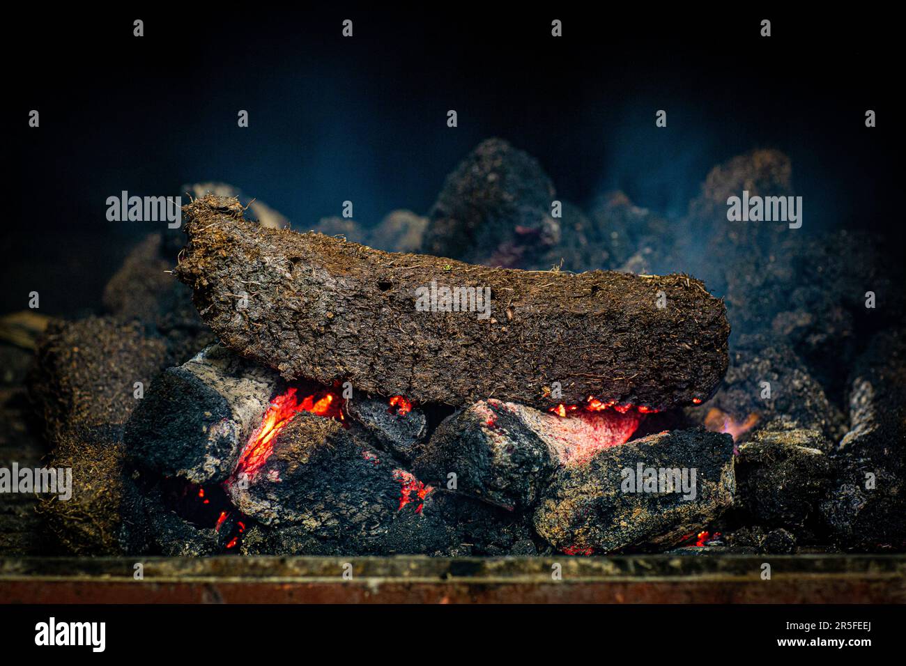 Peat fire in a whisky distillery kiln at Kilchoman distillery , Islay, Scotland Stock Photo
