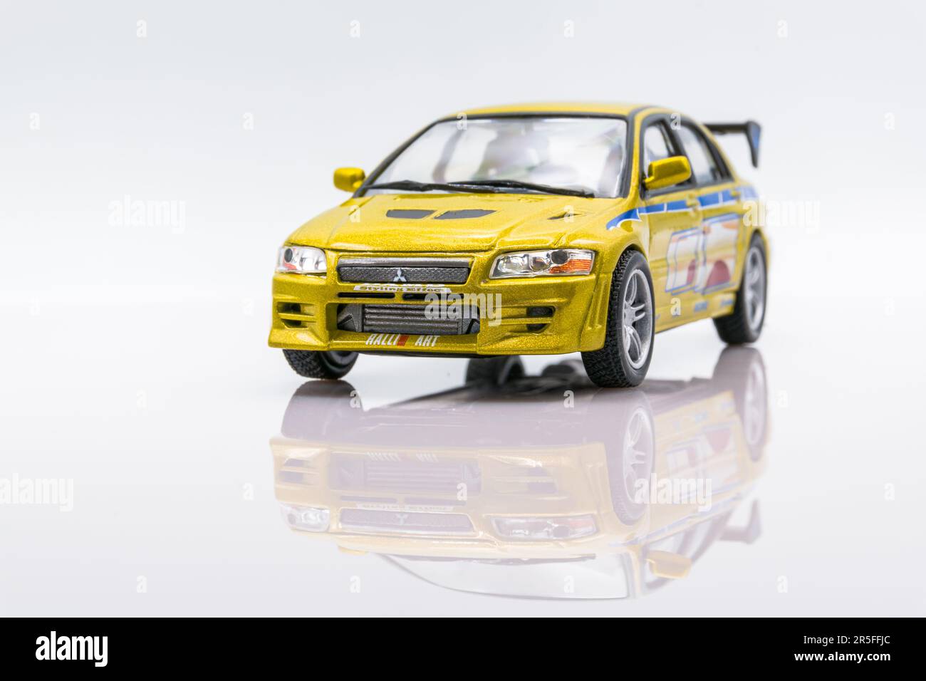 Fast&Furious Mitsubishi Lancer Evolution VII 143 model car, front view, white background with