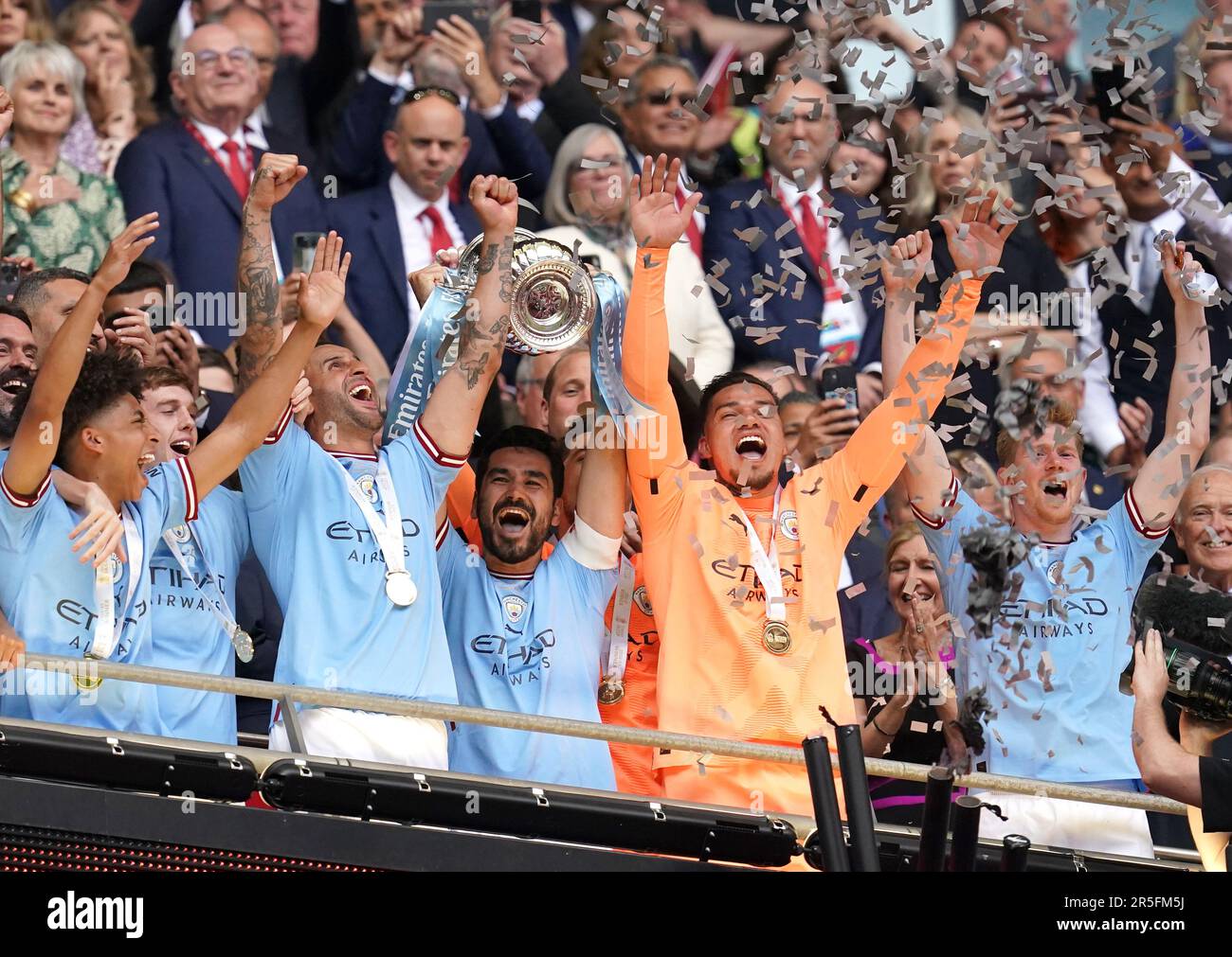 Manchester City's Ilkay Gundogan lifts the Emirates FA Cup trophy