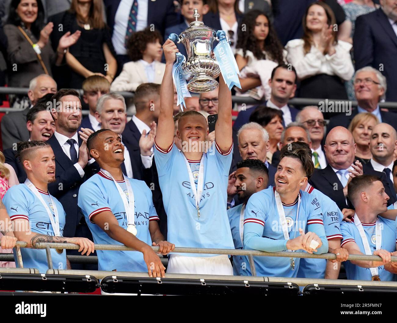 Manchester City's Erling Haaland lifts the Emirates FA Cup trophy