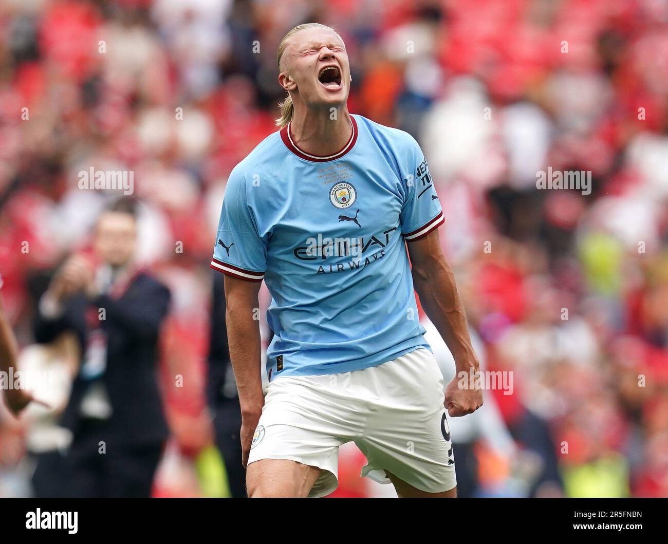 Manchester City's Erling Haaland holds the winners trophy as he celebrates  winning the English FA Cup final soccer match between Manchester City and  Manchester United at Wembley Stadium in London, Saturday, June