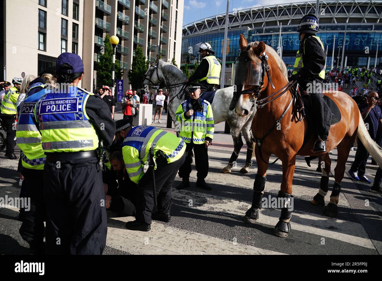 Police make an arrest outside Wembley Stadium after the Emirates FA Cup ...