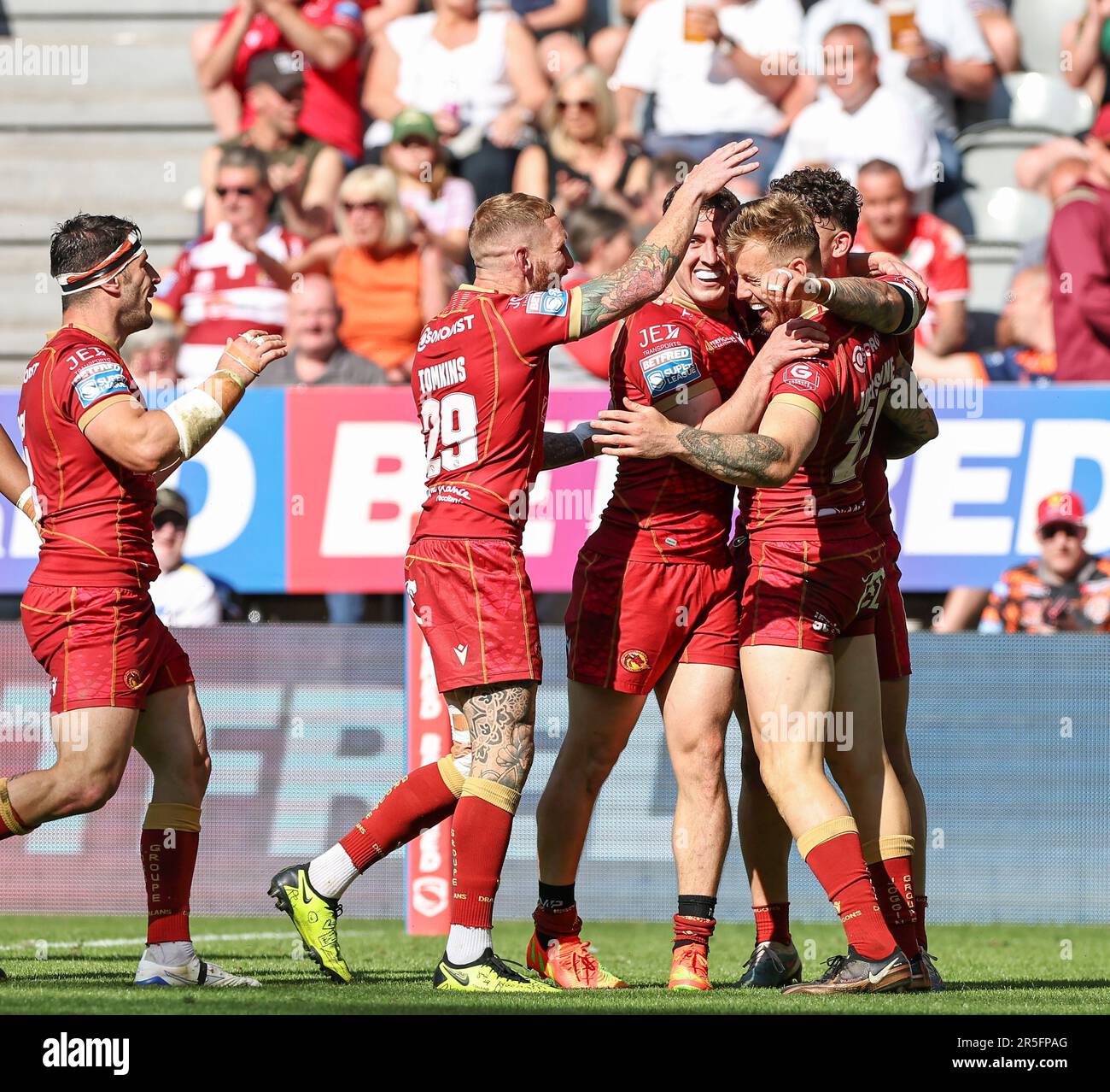 St James Park, Newcastle, UK. 3rd June, 2023. Betfred Super League Magic Weekend Rugby League, Wigan Warriors versus Catalans Dragons; Catalans Dragons Tom Johnstone celebrates with Sam Tomkins and Matt Whitley after he scores a try in the 43rd minute to make the score 8-30 Credit: Action Plus Sports/Alamy Live News Stock Photo