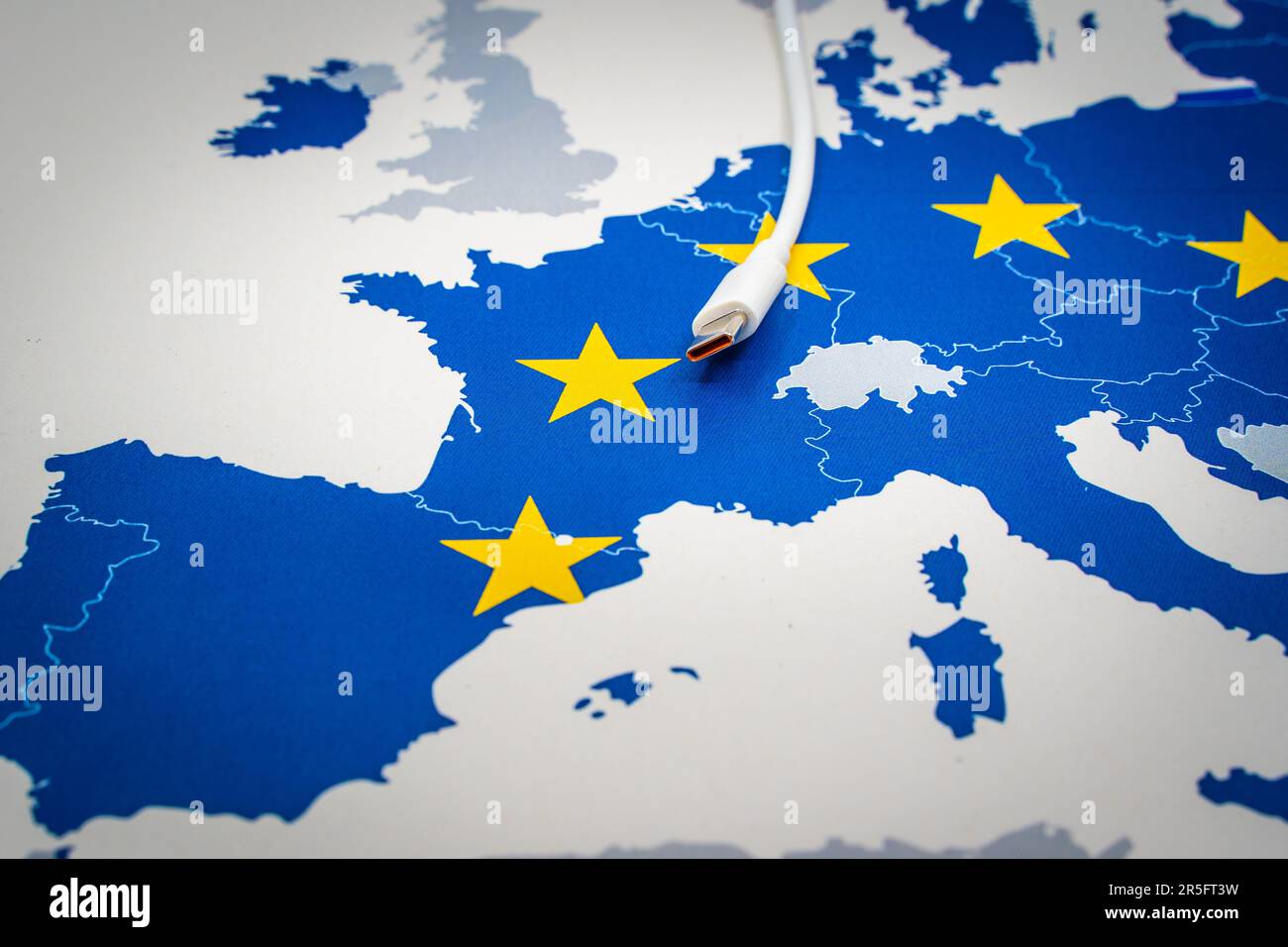 USB-C cable over an european map with the EU flag. Stock Photo