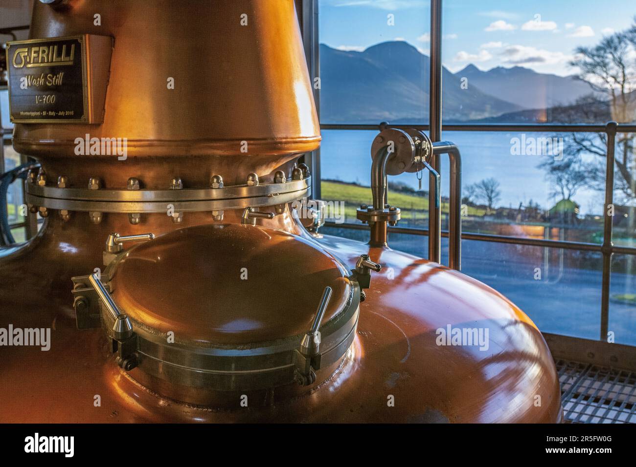Raasay distillery still room looks out across the sound to the Cuillins, Skye s brooding mountain range on the Hebridean Isle of Raasay , Scotland Stock Photo