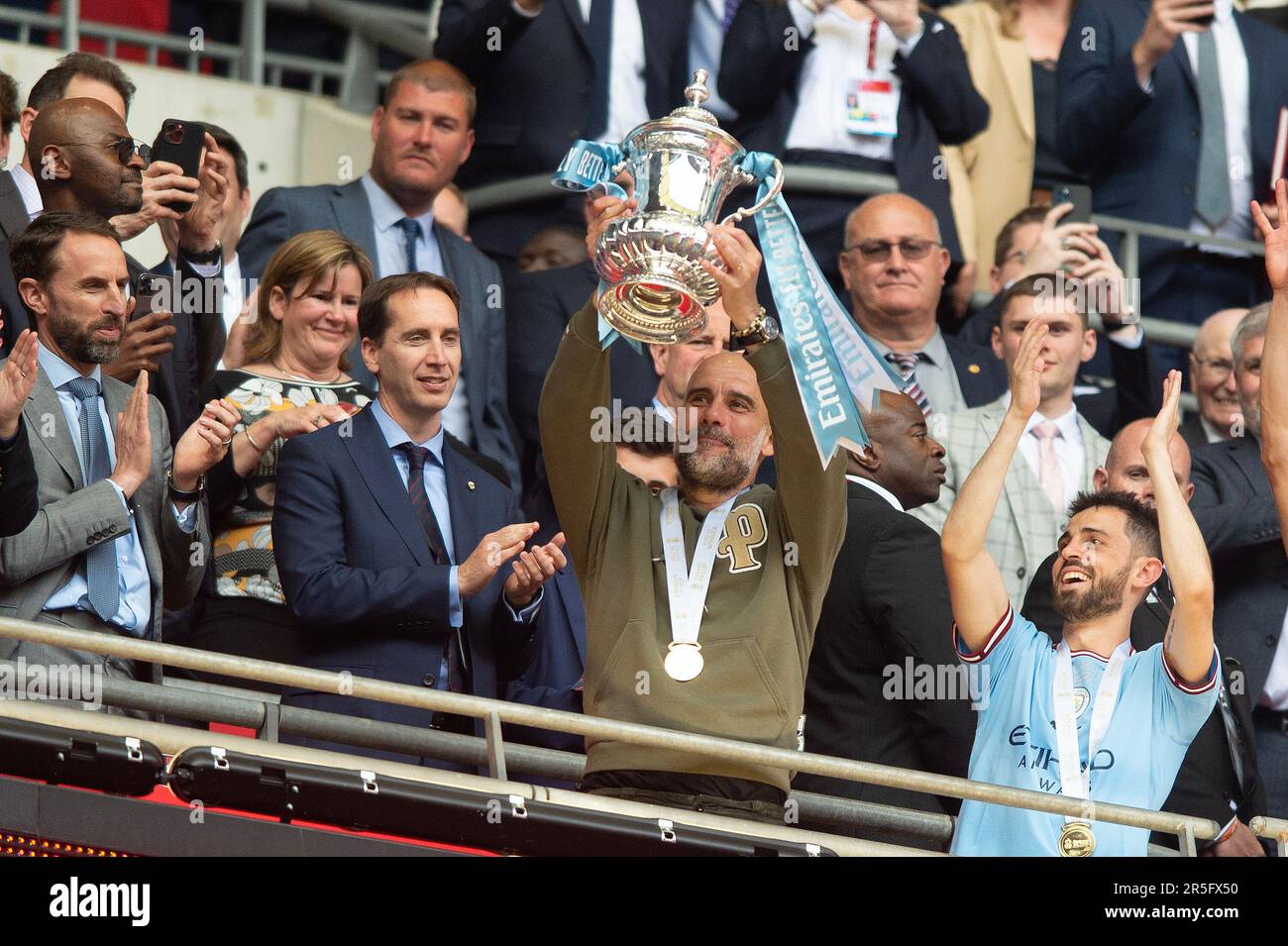 London, UK. 03rd June, 2023. Josep Guardiola manager of Manchester City lifts the trophy during the The FA Cup Final match between Manchester City and Manchester United at Wembley Stadium, London, England on 3 June 2023. Photo by Salvio Calabrese. Editorial use only, license required for commercial use. No use in betting, games or a single club/league/player publications. Credit: UK Sports Pics Ltd/Alamy Live News Stock Photo