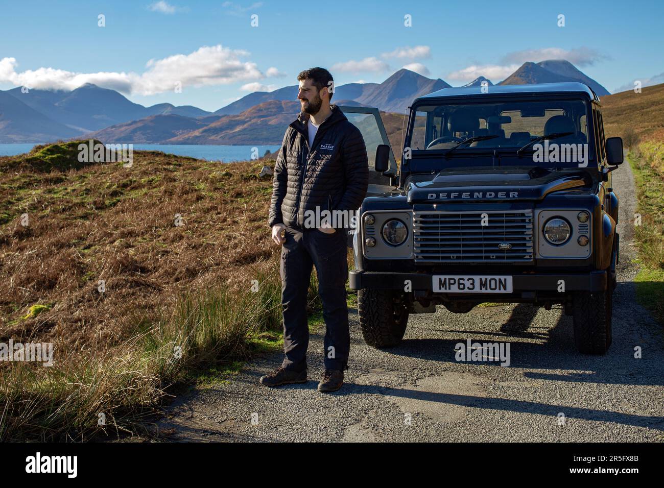 Norman Gillies Raasay distillery manager with his Land Rover on the Hebridean Isle of Raasay , Scotland Stock Photo