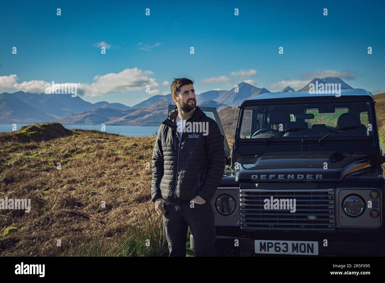 Norman Gillies Raasay distillery manager with his Land Rover on the Hebridean Isle of Raasay , Scotland Stock Photo