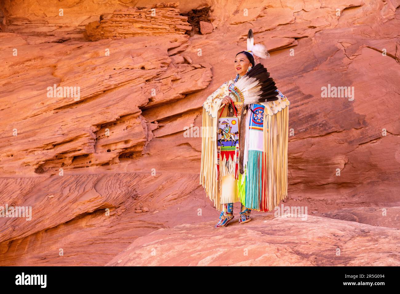 American Indian Navajo woman at Honeymoon Arch in Mystery Valley of the