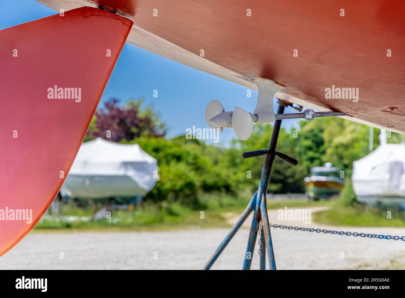 Detail image of the prop and rudder on a sail boat out of the water Stock Photo