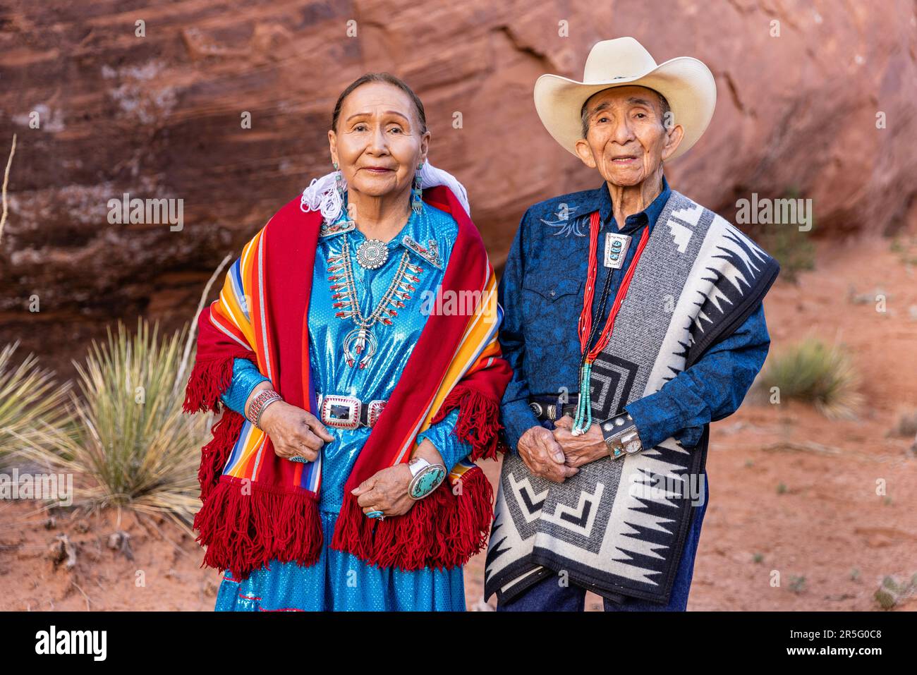American Indian Navajo couple in Mystery Valley of Monument Valley Navajo Tribal Park, Arizona, United States Stock Photo