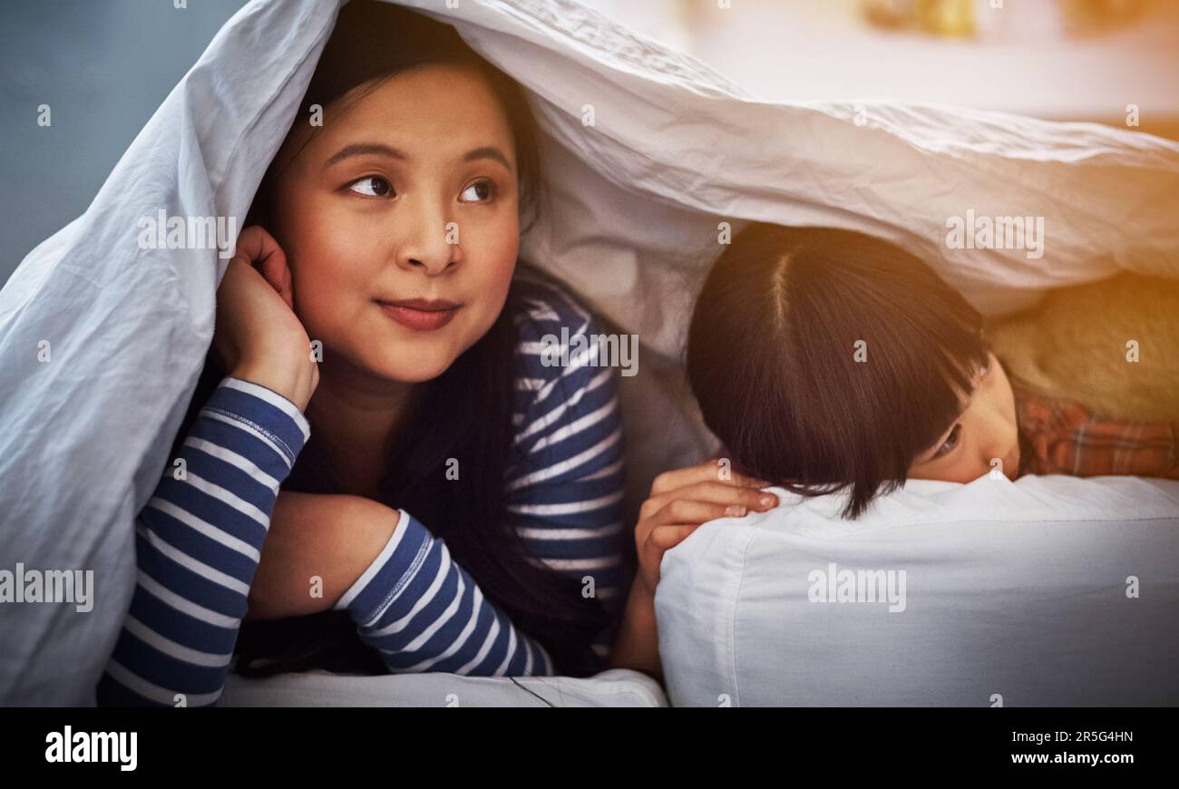 Relaxing with her little one. an attractive young woman and her