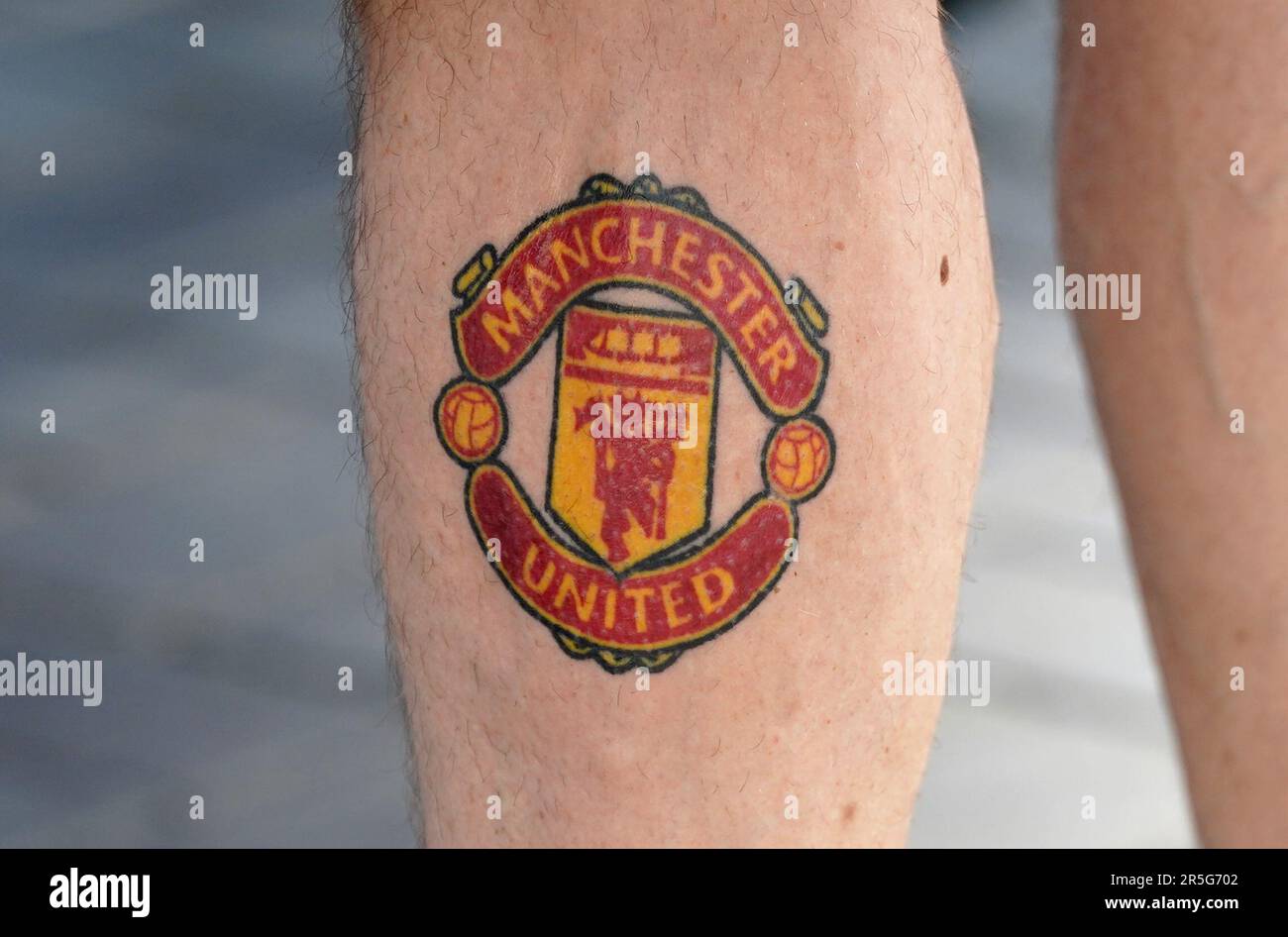 A detailed view of a tattoo on the leg of a Manchester United fan ahead of the Emirates FA Cup final at Wembley Stadium, London. Picture date: Saturday June 3, 2023. Stock Photo