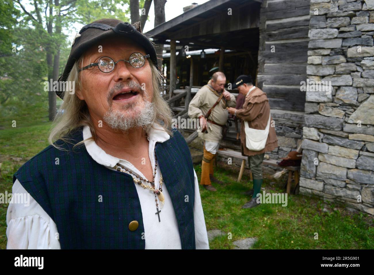 A US history reenactor dressed in 19th centurystyle clothing speaks to
