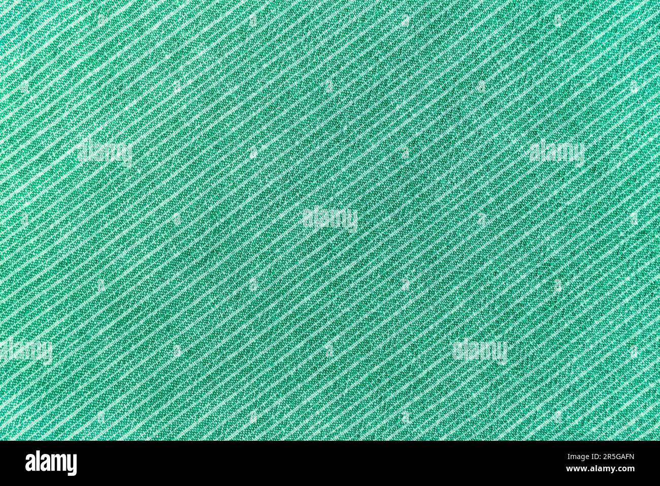 Natural linen texture as background. Cotton fabric with green and white