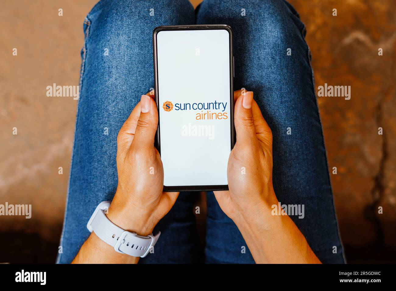 In this photo illustration, the Sun Country Airlines logo is displayed