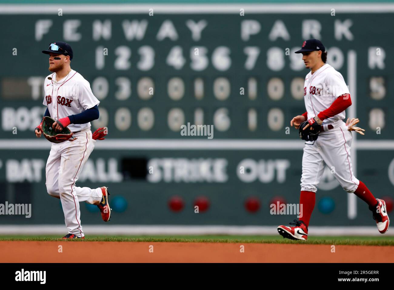 Boston Red Sox's Alex Verdugo, left, and Jarren Duran run past the