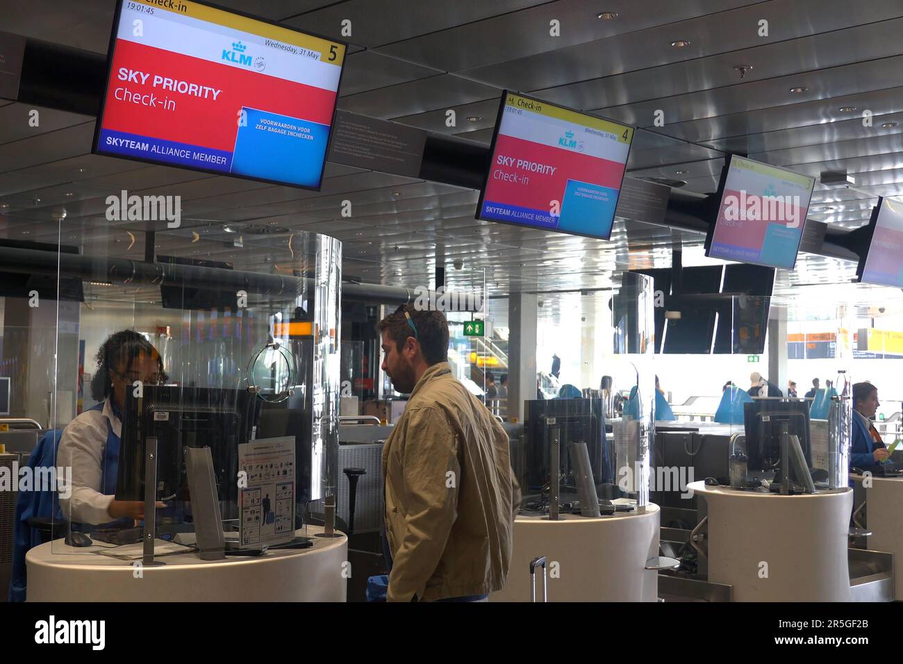 A passenger at the Sky Priority check in counter of KLM and Air France