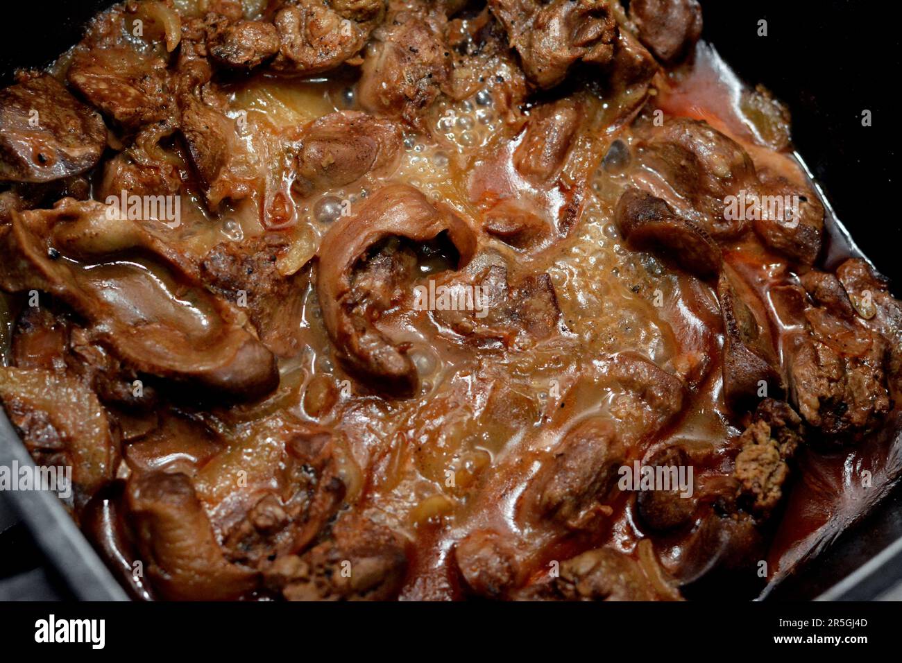 cooked chicken livers, gizzards and hearts, selective focus of fresh