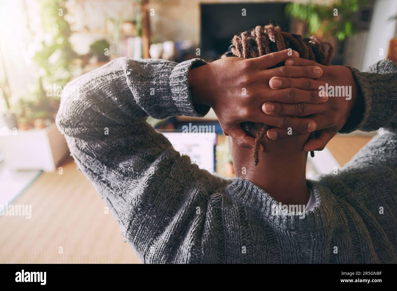 Sitting hands behind the head hi-res stock photography and images - Alamy