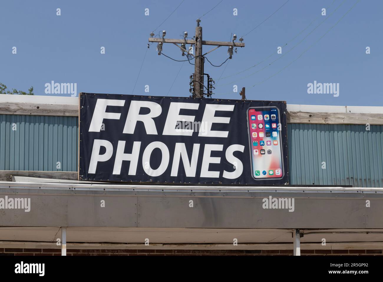 Danville - Circa June 2023: FREE PHONES advertisement with an iPhone. Free or reduced cost phones are an enticement to change providers. Stock Photo