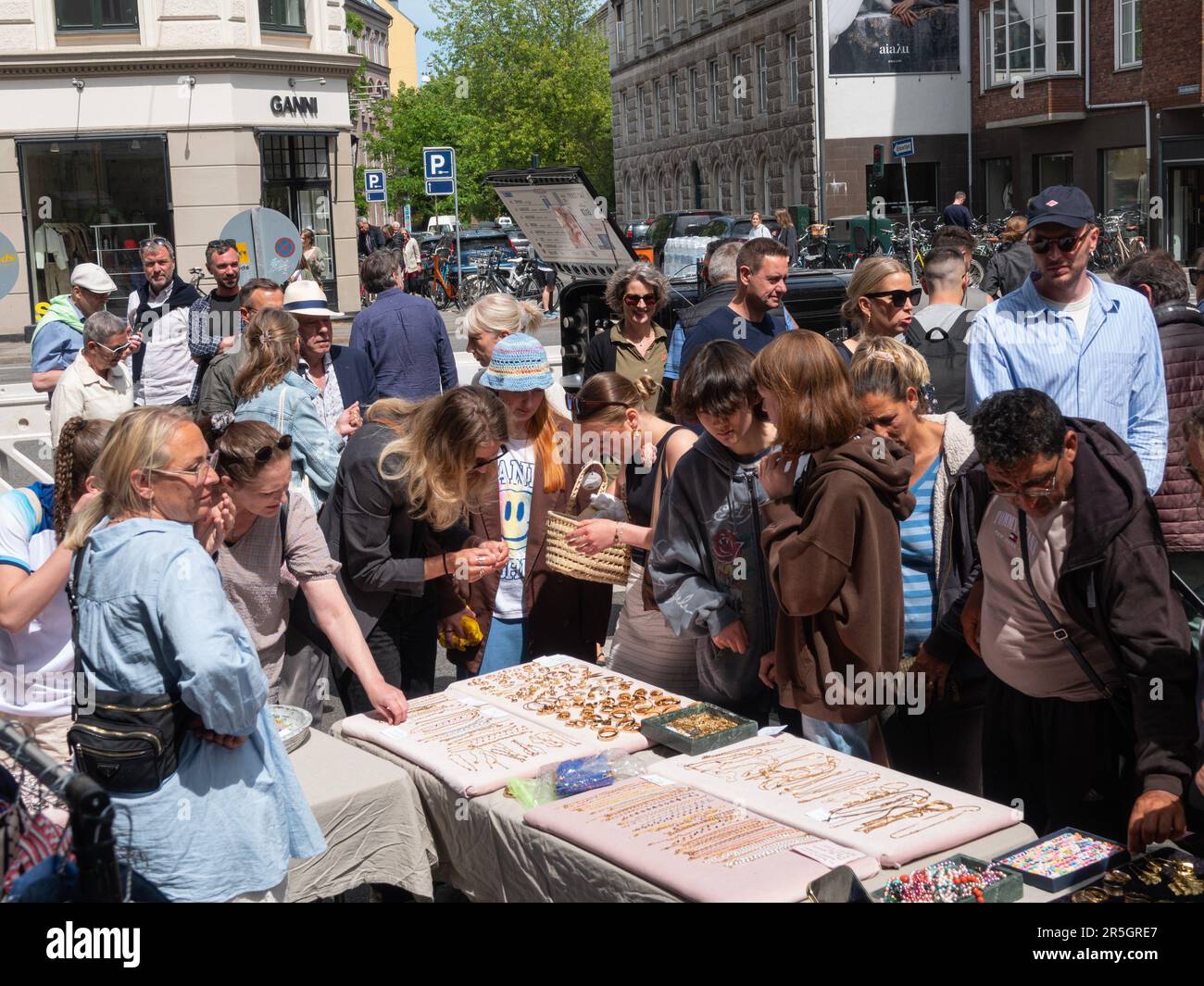 Street with flea market full of crowd of people. Copenhagen, Denmark - June 3, 2023. Stock Photo