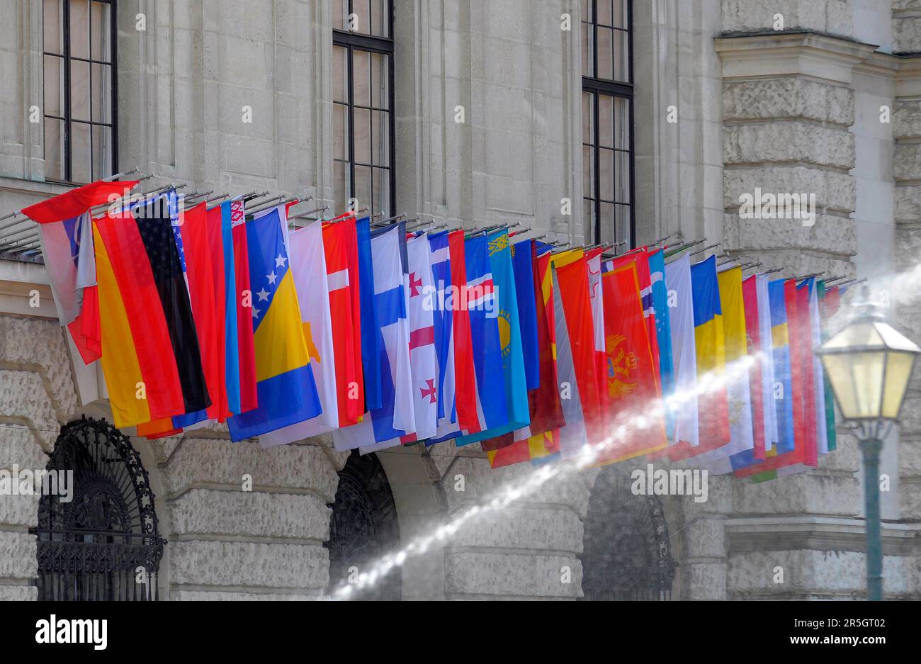 Austria, Vienna, international flags, water jet Stock Photo