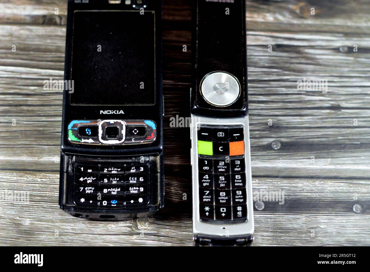 Cairo, Egypt, May 26 2023: Old rotating sliding Samsung mobile cell phone with keypad and buttons that rotates 180 degrees, Samsung and Old sliding No Stock Photo