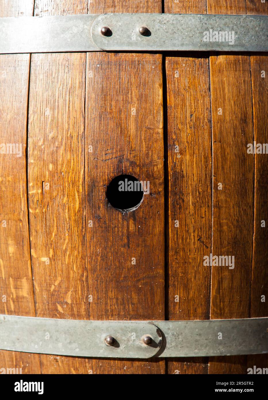 Old barrel made of wood used for Italian wine production Stock Photo