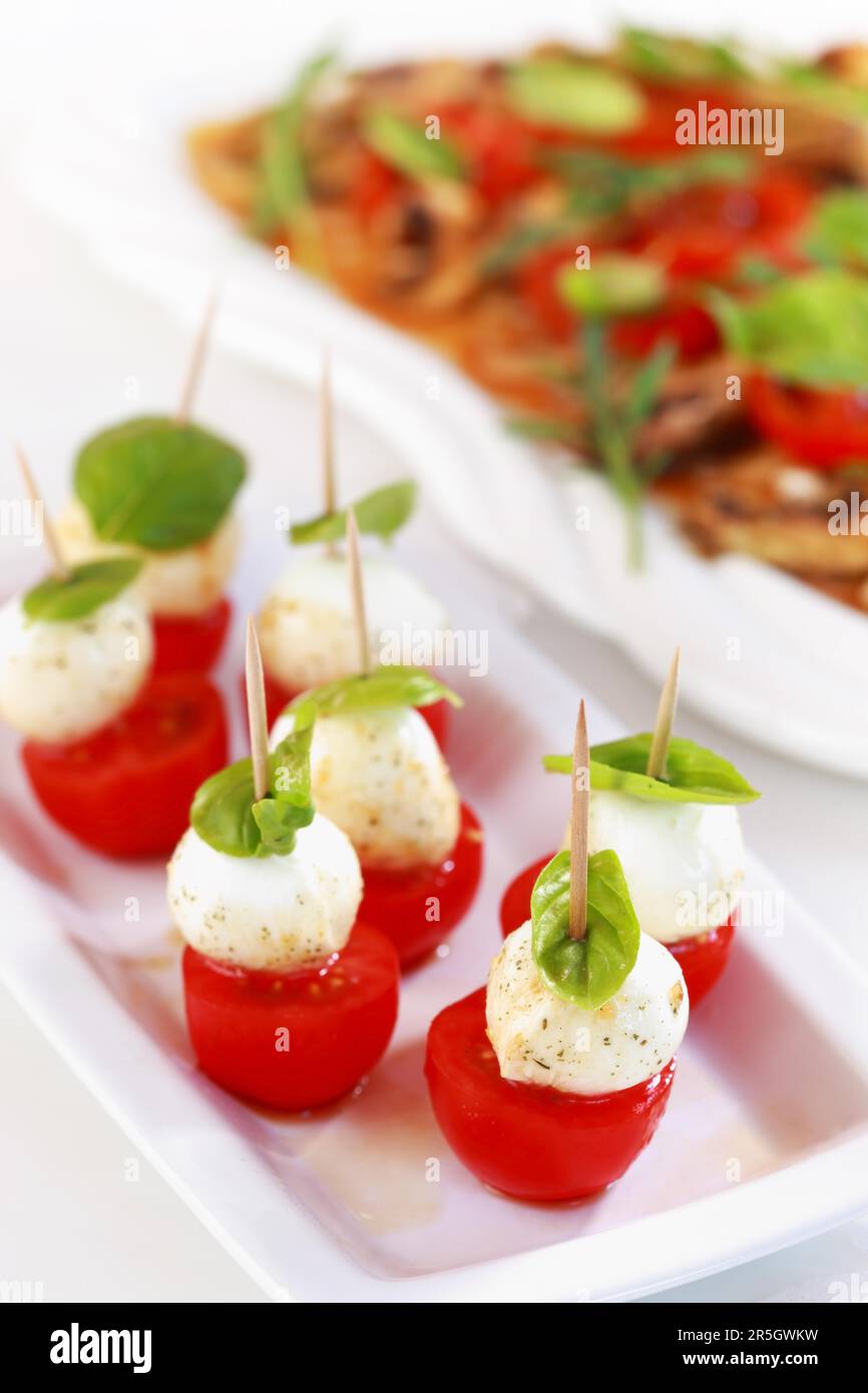 Delicious appetizer, mozzarella cheese with tomato and champignon ...